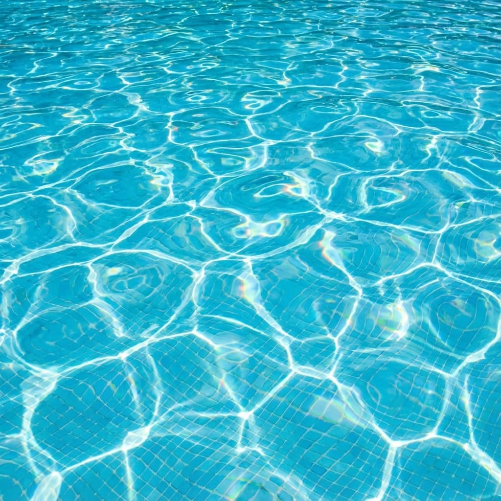 Bright sunlight refracted in swimming pool